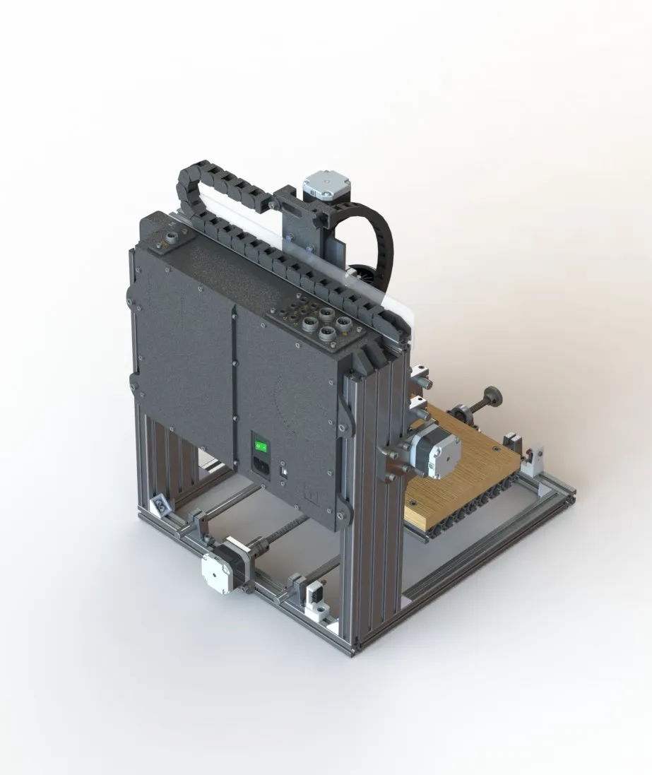 Machine rear — custom electronics enclosure mounted to the back of the T-slot frame. IEC inlet, power switch, and panel-mount motor and signal connectors are accessible at the rear